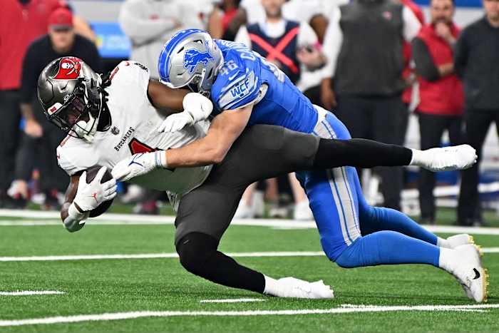 Detroit Lions linebacker Jack Campbell (46) tackles Tampa Bay Buccaneers running back Rachaad White (1) during the first quarter in a 2024 NFC divisional round game at Ford Field. Mandatory Credit: Lon Horwedel-USA TODAY Sports
